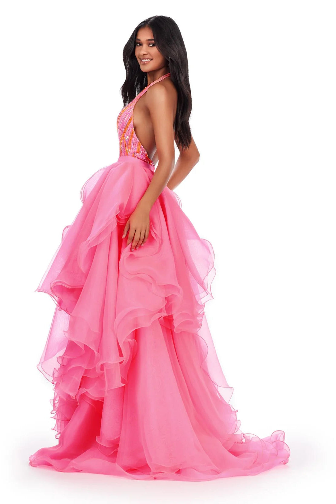 Woman wearing a pink evening gown on a white background