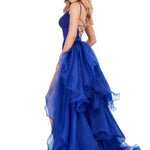 Woman wearing a blue evening gown on a white background