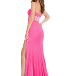 Pink evening gown with cut-out design and high slit on a white background