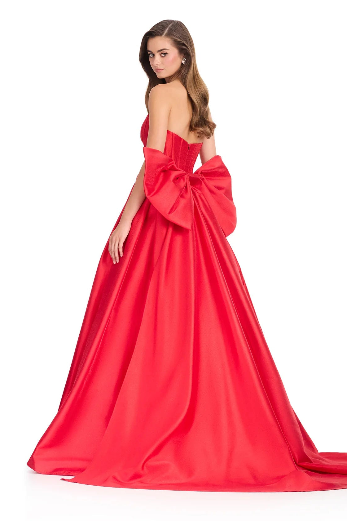 Red evening gown with a large bow detail on a white background