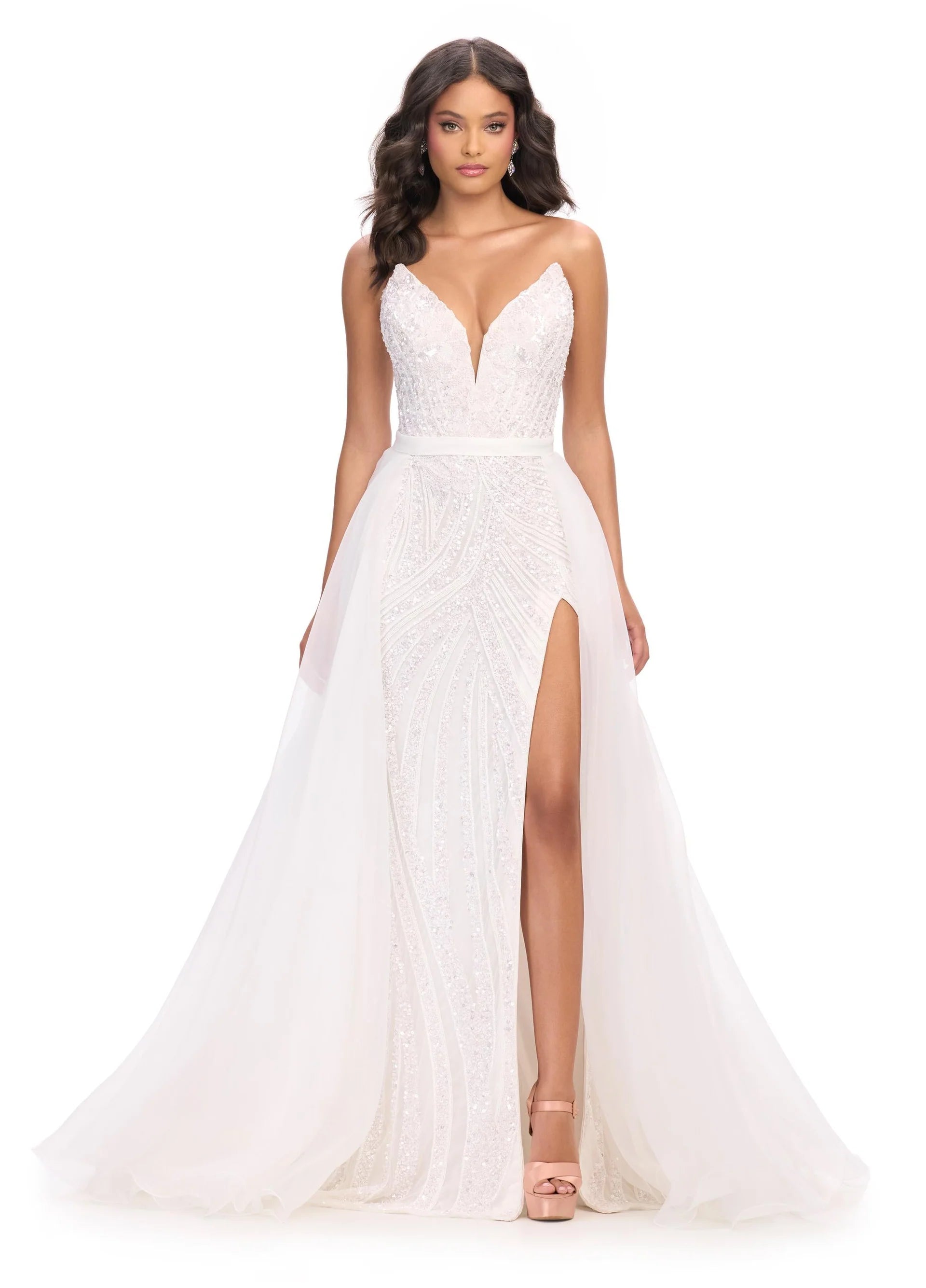 White evening gown with a deep neckline and side slit on a white background