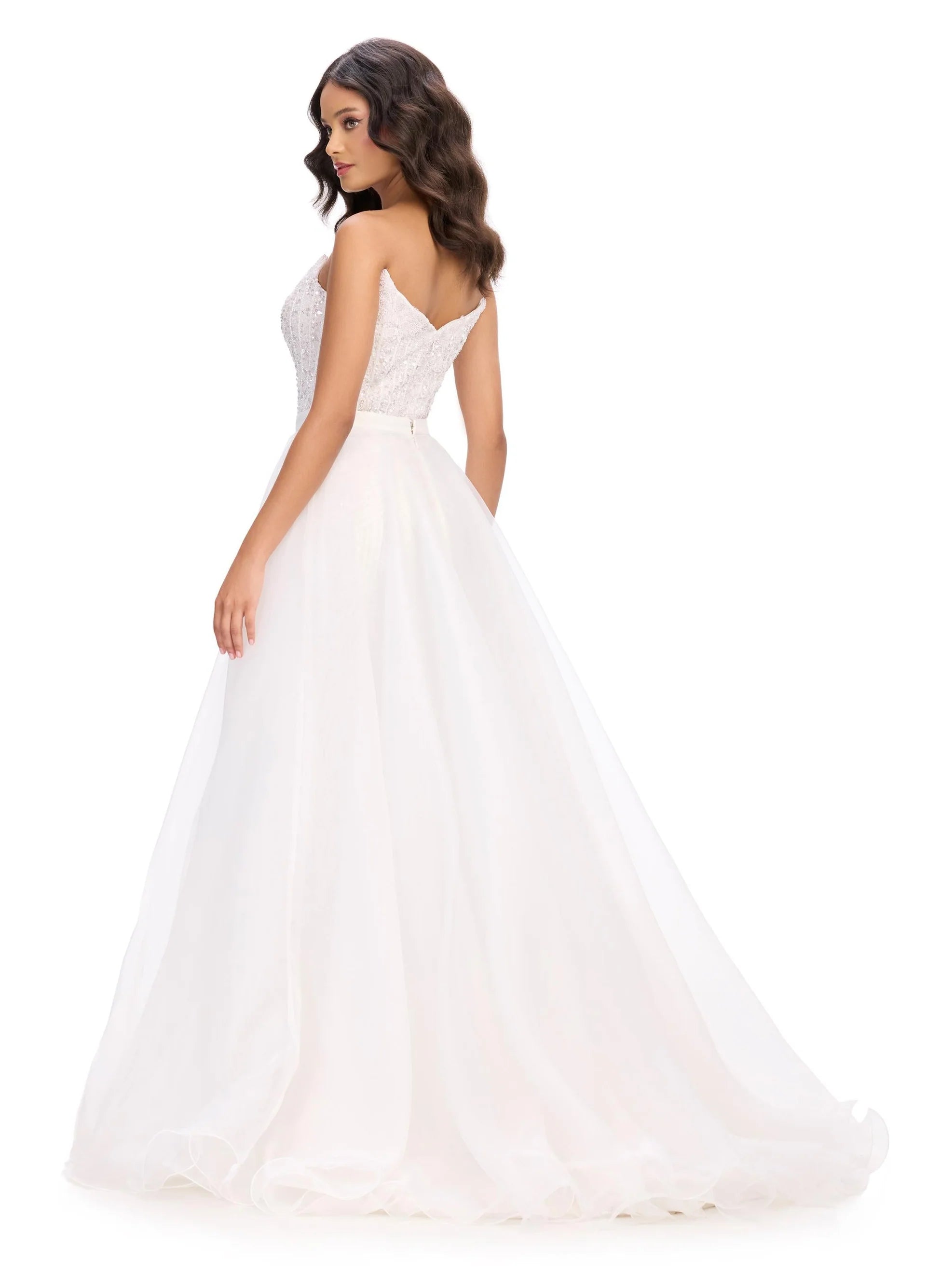 White wedding dress with lace detailing on a white background