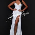 A woman modeling a floor-length white strapless gown with a sweetheart neckline, ruched bodice, high thigh slit, and a slight train against a dark studio background. A large white script watermark reading 'Jennifer Kayne' is overlaid across the center.