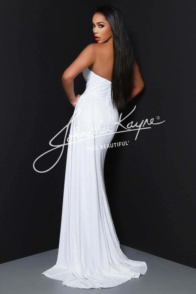 A woman modeling a floor-length white strapless gown with a fitted silhouette and long train, photographed against a dark studio background. A large 'Johnathan Kayne' watermark overlays the center.