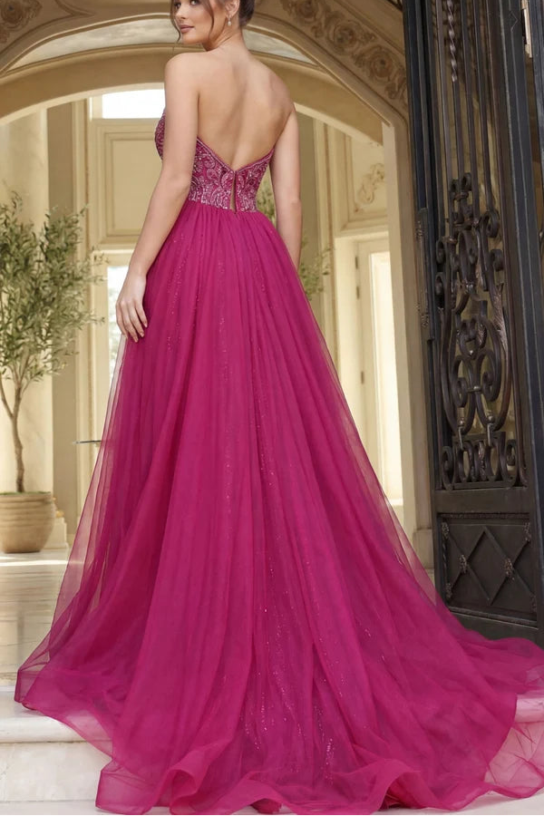 Pink evening gown with open back in an elegant interior setting