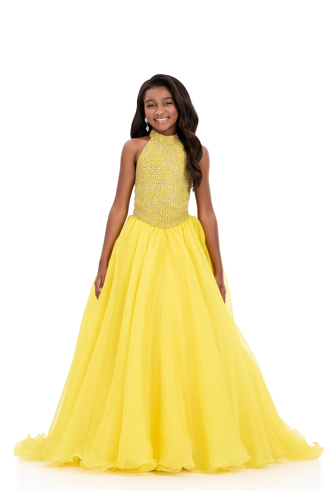 Girl wearing a yellow dress with a white background