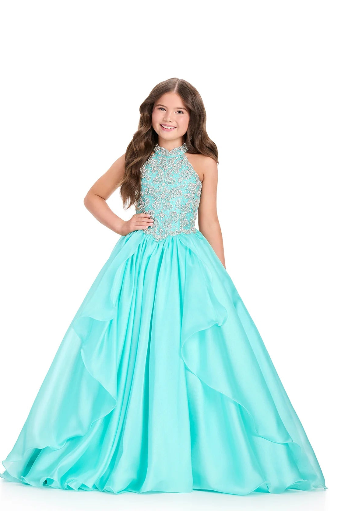 Girl wearing a turquoise gown with a white background