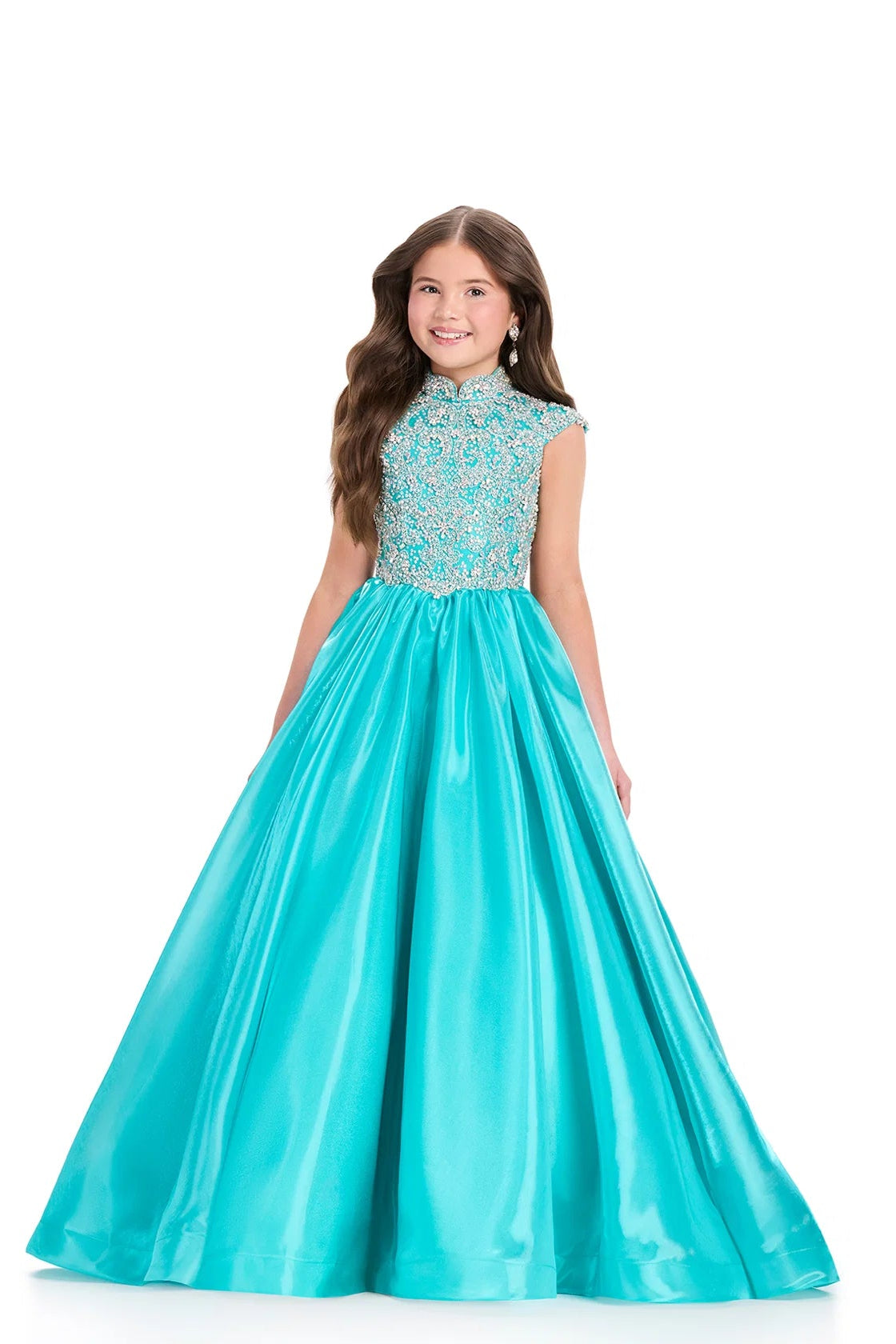Girl wearing a turquoise evening gown with beaded top on a white background