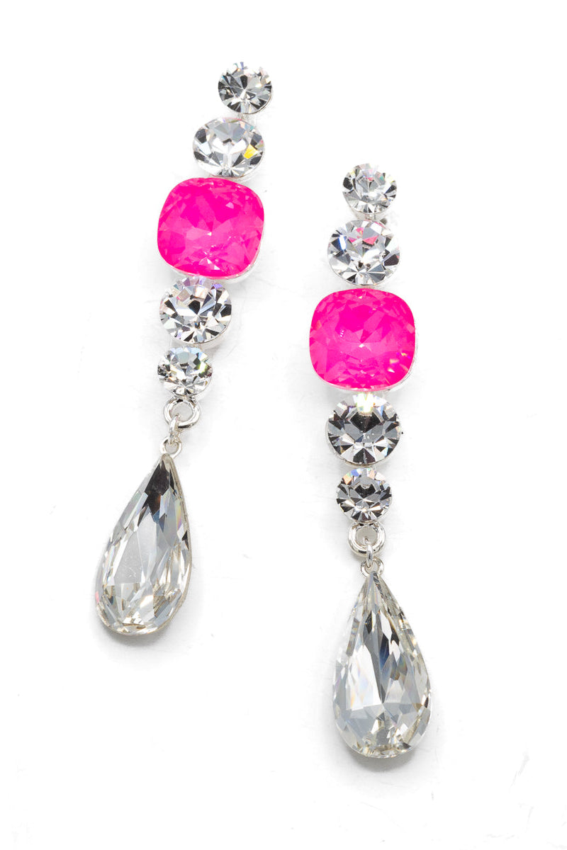 Pair of earrings with pink gemstones and teardrop-shaped crystals on a white background