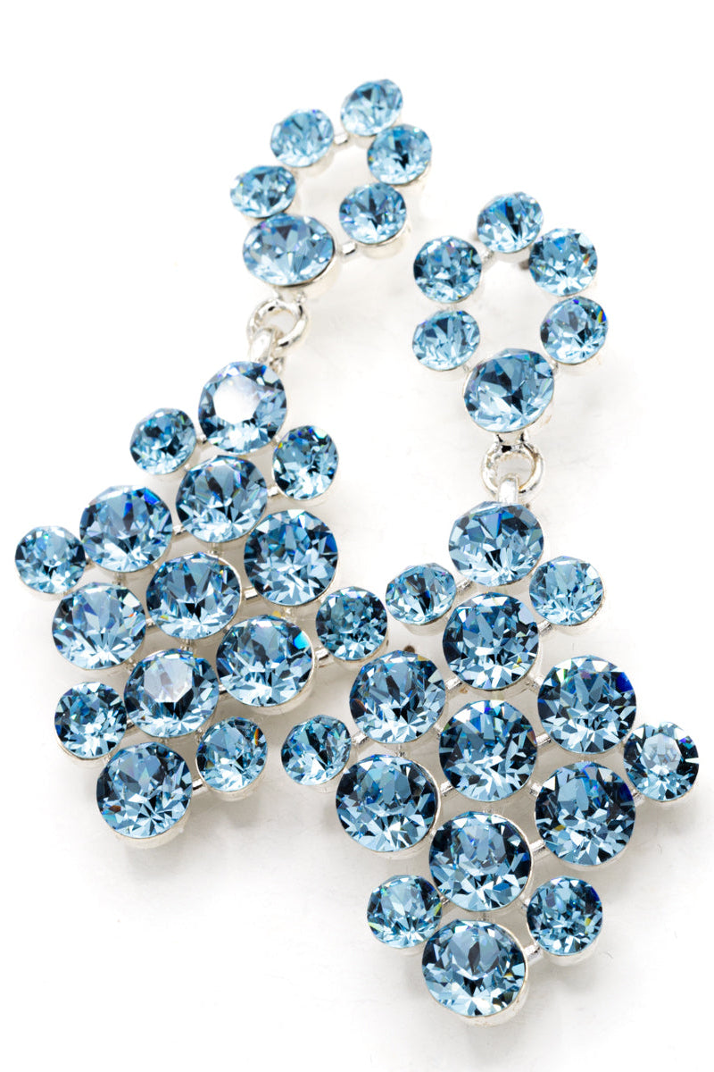 Blue crystal earrings on a white background