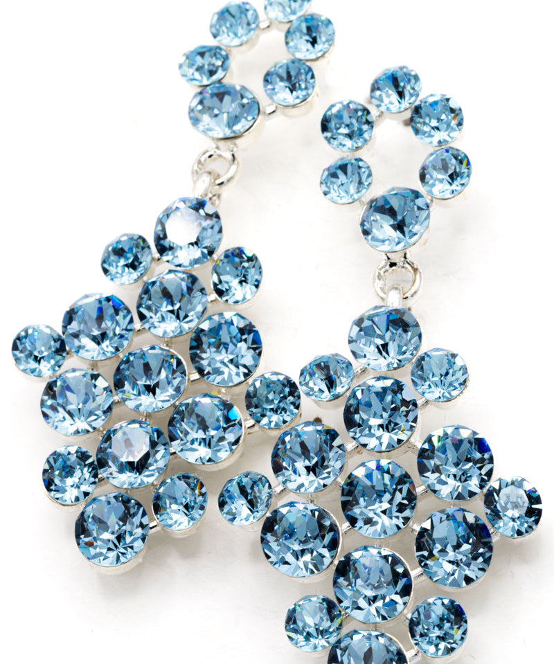 Blue crystal earrings on a white background