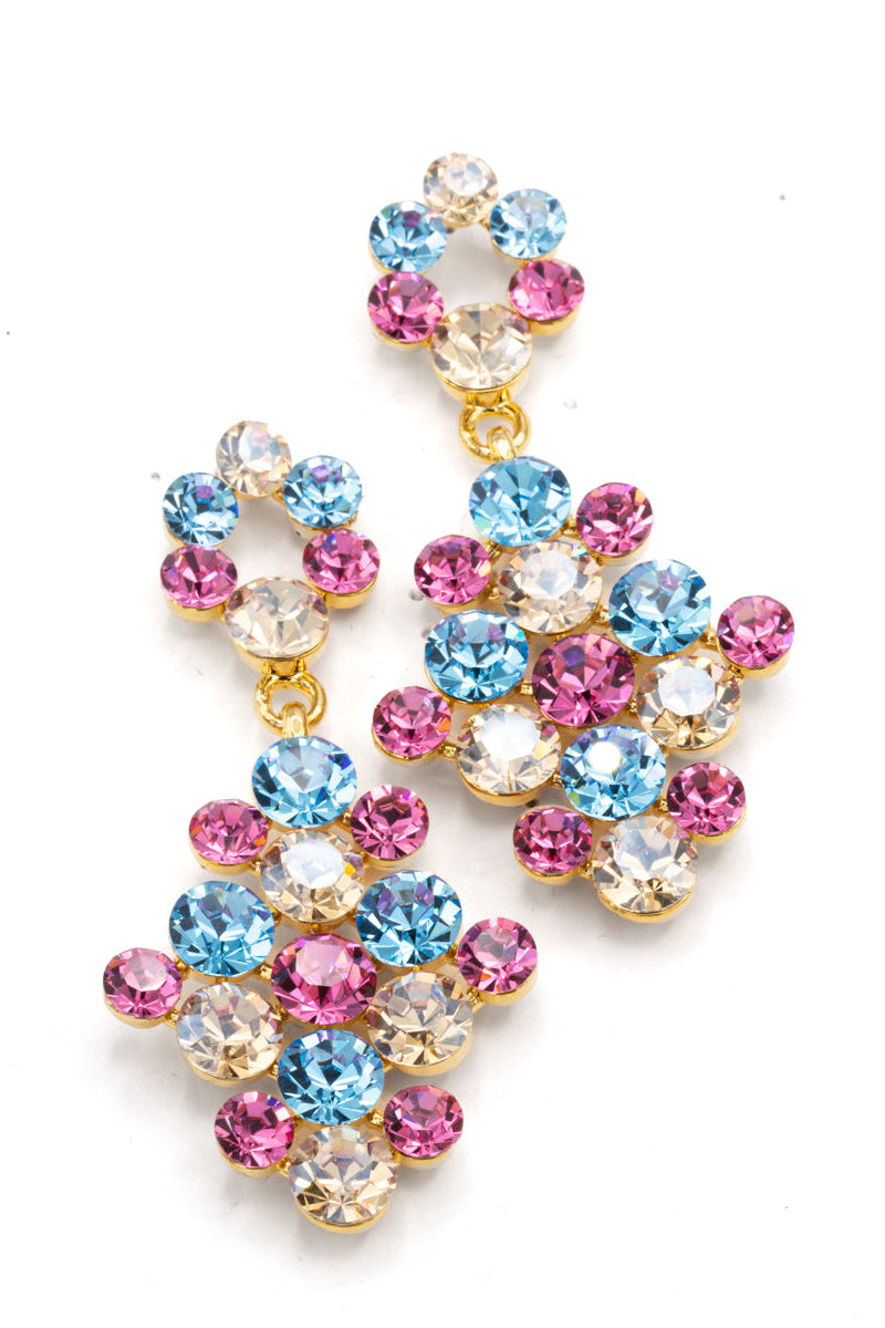 A pair of gold-tone dangle earrings adorned with multiple round-cut rhinestones in light blue, pink, and clear, arranged in a cascading floral cluster design on a white background.