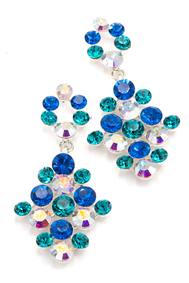 A pair of dangling statement earrings made of faceted rhinestones in royal blue, teal, and iridescent clear, set in silver-tone metal on a white background.