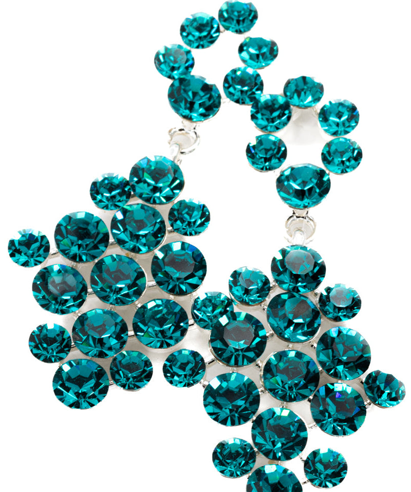 Teal rhinestone decorative item on a white background