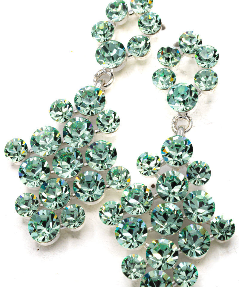 Green gemstone earrings on a white background - pageant/formal