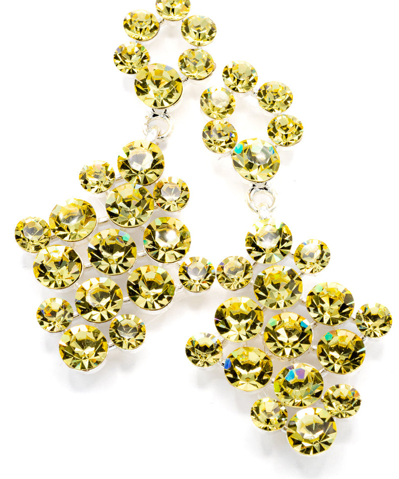 Pair of light yellow gemstone earrings on a white background