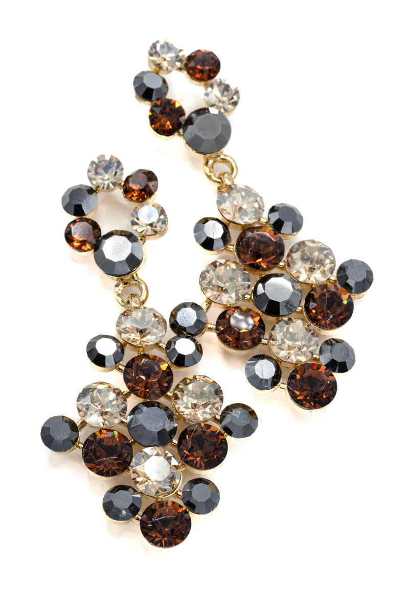 Elegant earring with multicolored animal print gemstones on a white background