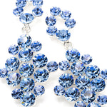 Blue crystal earrings on a white background