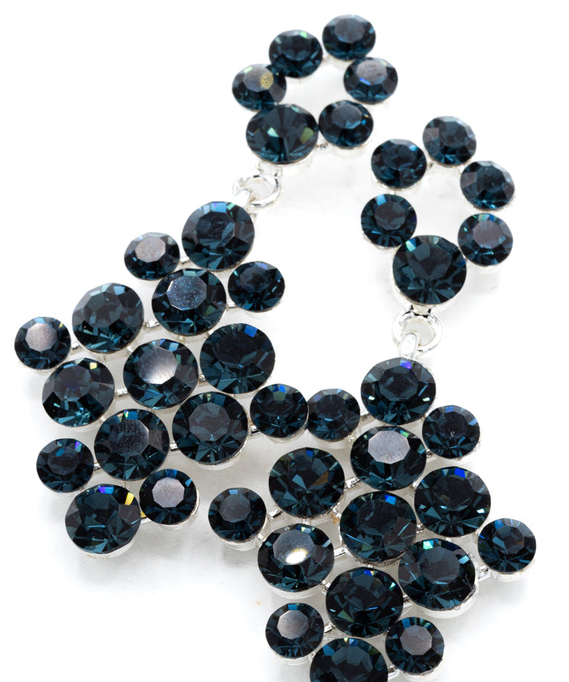 Pageant/Formal earrings with blue gemstones on a white background
