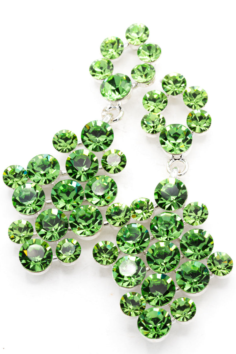 Green gemstone earrings on a white background