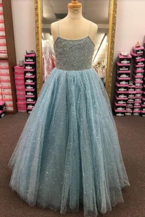 A light blue sparkly tulle ball gown with a beaded silver bodice displayed on a mannequin in a retail store.