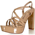 A single patent leather platform sandal in a light tan/beige color, featuring criss-cross straps, a high block heel, and a buckle closure on the ankle strap. The brand name 'MARC DEFANG' is printed on the insole.