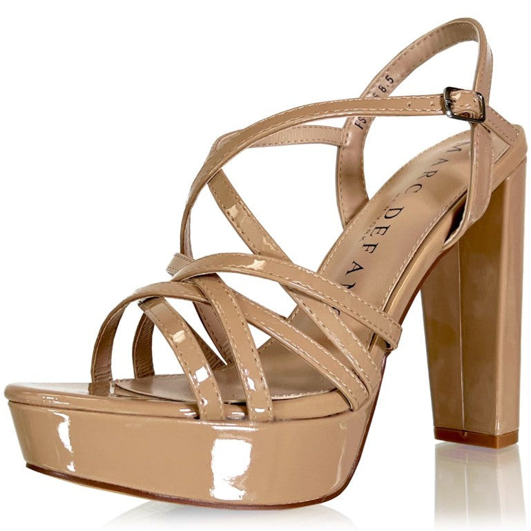 A single patent leather platform sandal in a light tan/beige color, featuring criss-cross straps, a high block heel, and a buckle closure on the ankle strap. The brand name 'MARC DEFANG' is printed on the insole.