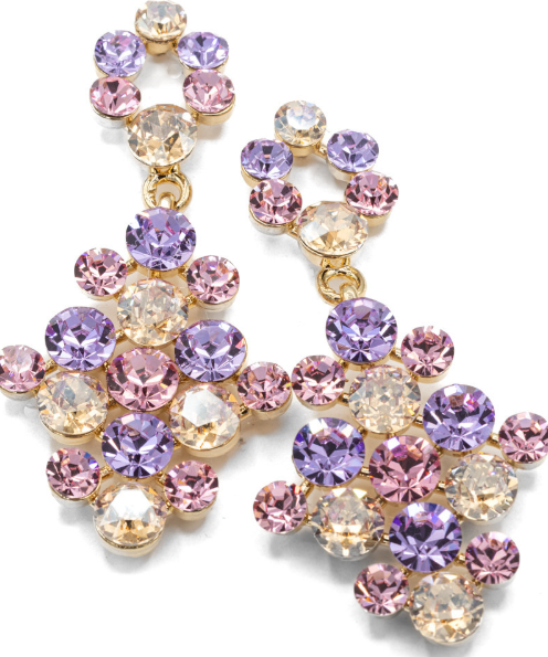 A pair of gold-tone statement dangle earrings adorned with faceted crystal rhinestones in shades of purple, pink, and clear, arranged on a clean white background.