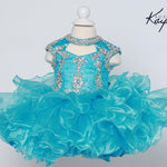 Turquoise dress with sparkling embellishments on a mannequin against a light gray background.