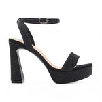 RSG Formals DeBlossom Regina black shimmer platform heels with an open toe, block heel, and adjustable ankle strap.