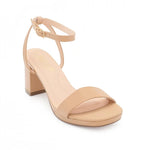 RSG Formals DeBlossom Nelly nude open-toe block heel sandals with an adjustable ankle strap and buckle closure.