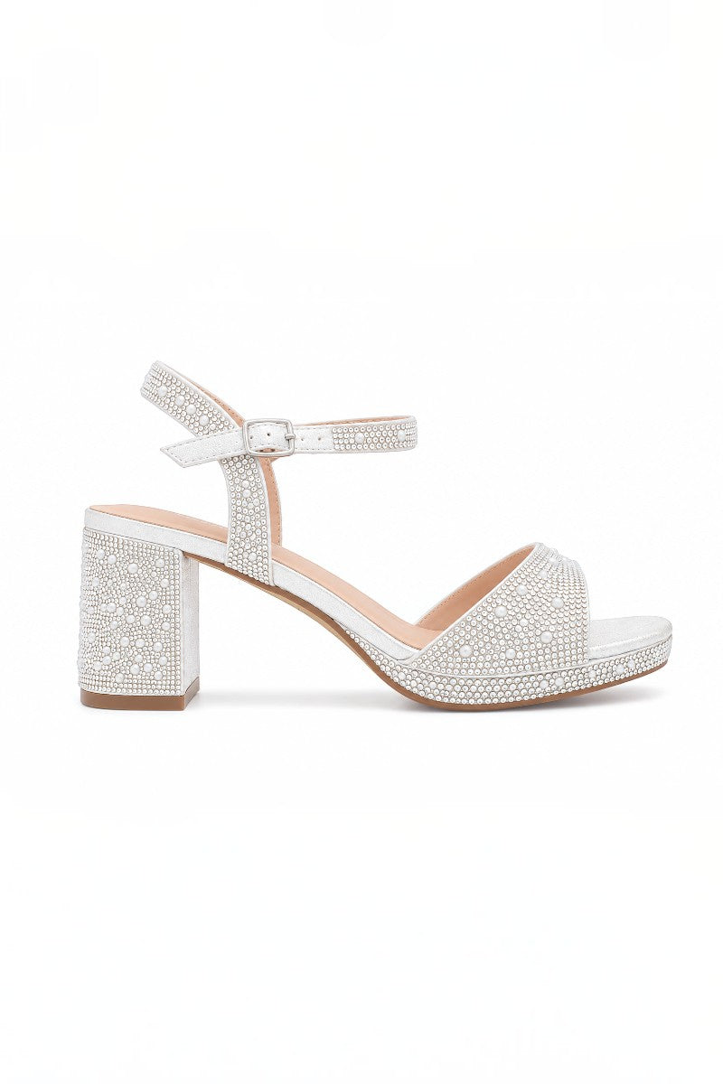 RSG Formals DeBlossom Nelly white shimmer block heel sandals with rhinestone embellishments and ankle strap