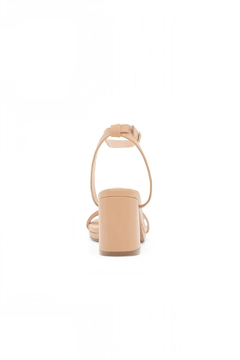RSG Formals DeBlossom Nelly nude block-heel sandals with an adjustable ankle strap, shown from a rear view.