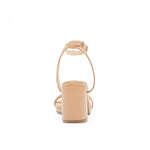 RSG Formals DeBlossom Nelly nude block-heel sandals with an adjustable ankle strap, shown from a rear view.
