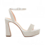RSG Formals DeBlossom Regina silver shimmer platform heels with block heel, open toe, and adjustable buckle strap.