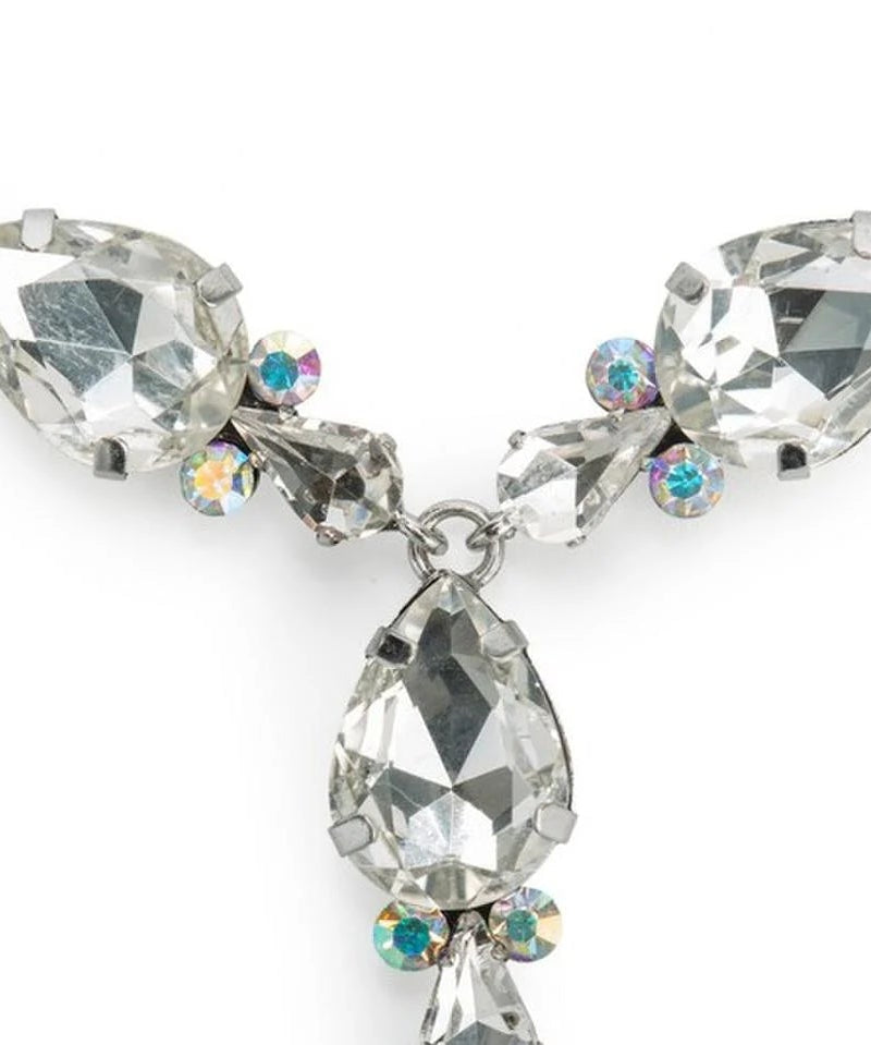 A silver-tone crystal necklace featuring large faceted marquise-cut clear rhinestones and smaller round iridescent crystals, shown on a plain white background.